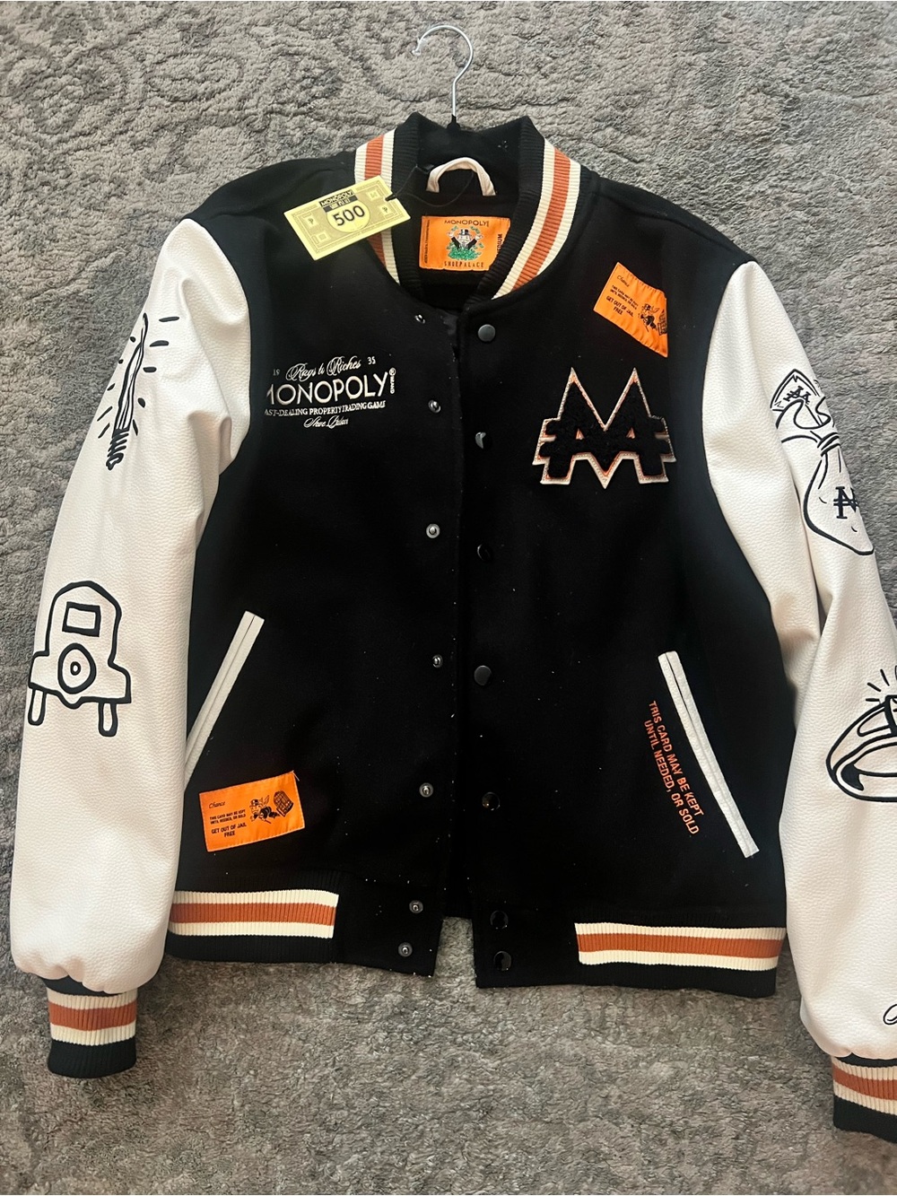 Black & White Varsity Jacket with Graphic Accents